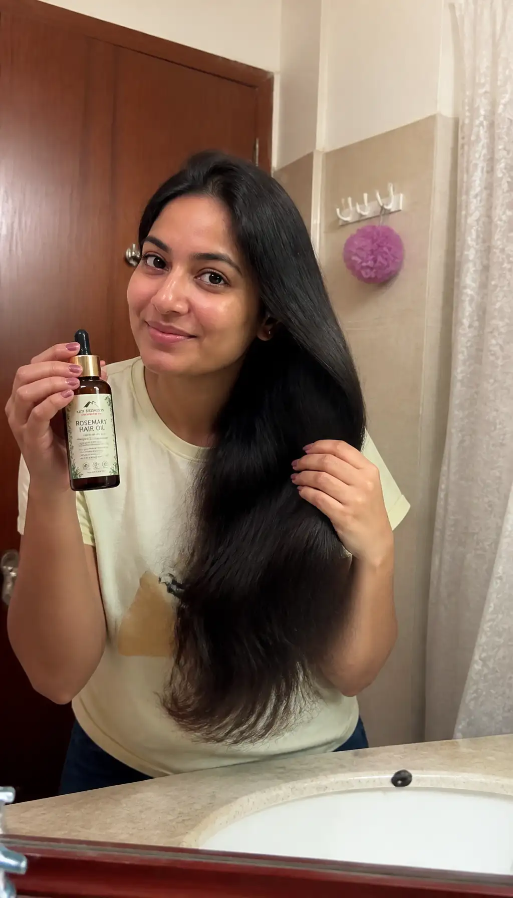Woman holding a hair serum bottle in her bathroom, phone-camera style